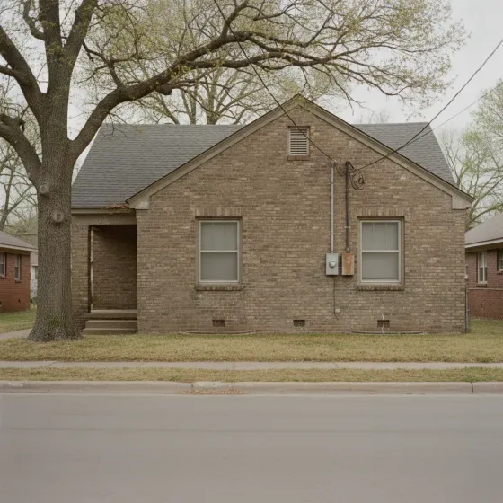 Older Denton square brick home with dated wiring service mast